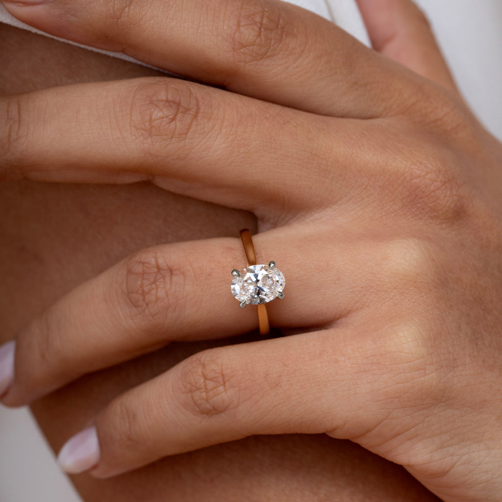 Oval engagement ring shown as reference for a plain matching wedding band